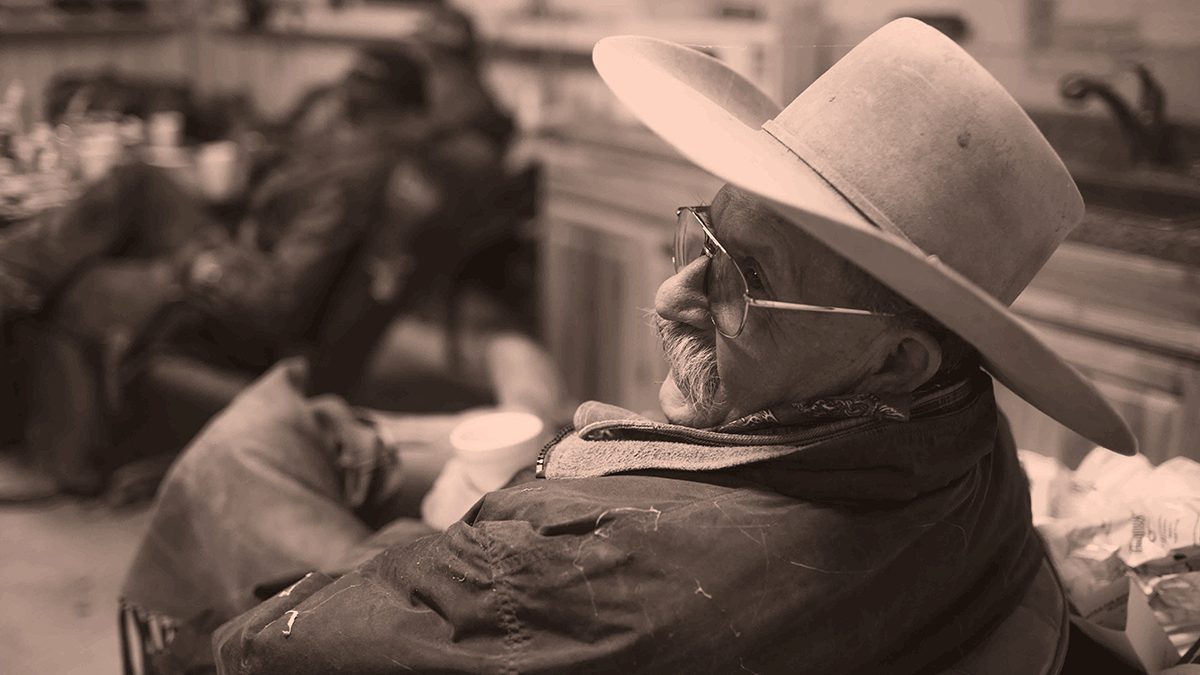 Male Friona employee in cowboy hat relaxing