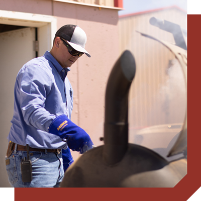 Male Friona employee barbecuing